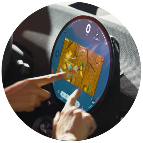 A hand holding up his phone with the MINI App open on the screen.