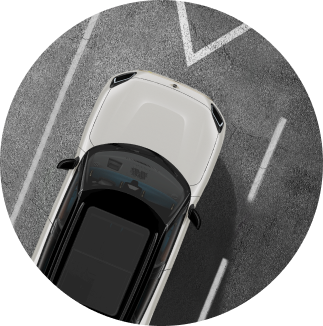 The MINI Countryman SE ALL4 speeding down a road with water in the distance.