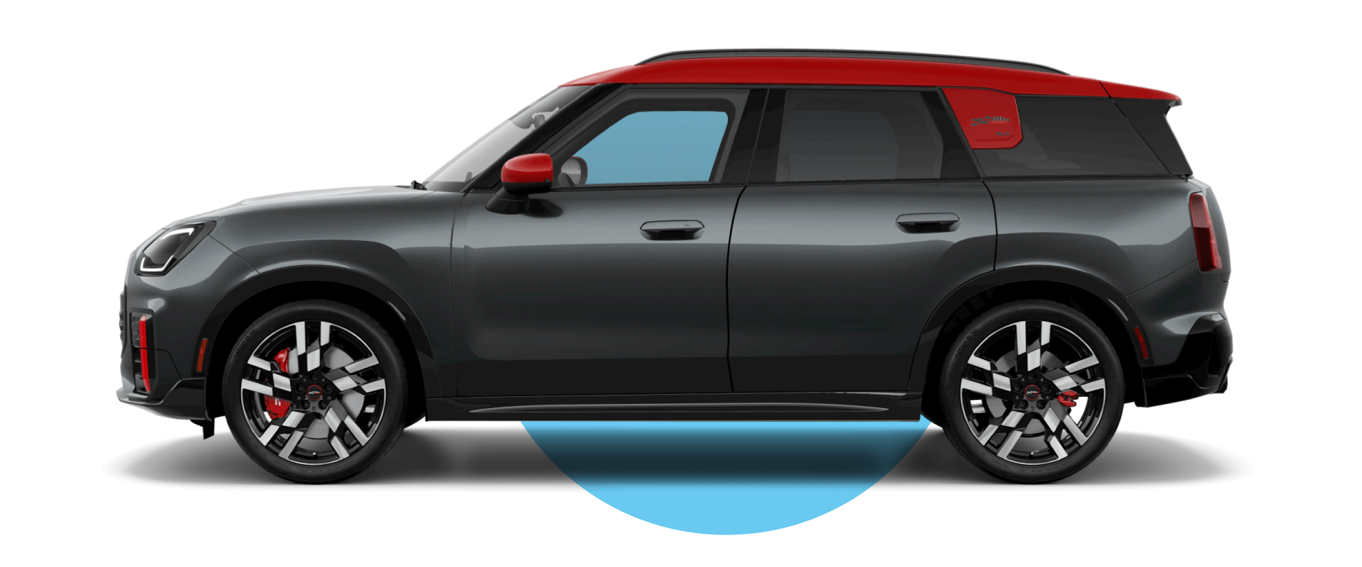 Side view of a MINI JCW Countryman ALL4 in the Legend Grey body color, facing left with its shadow underneath it.