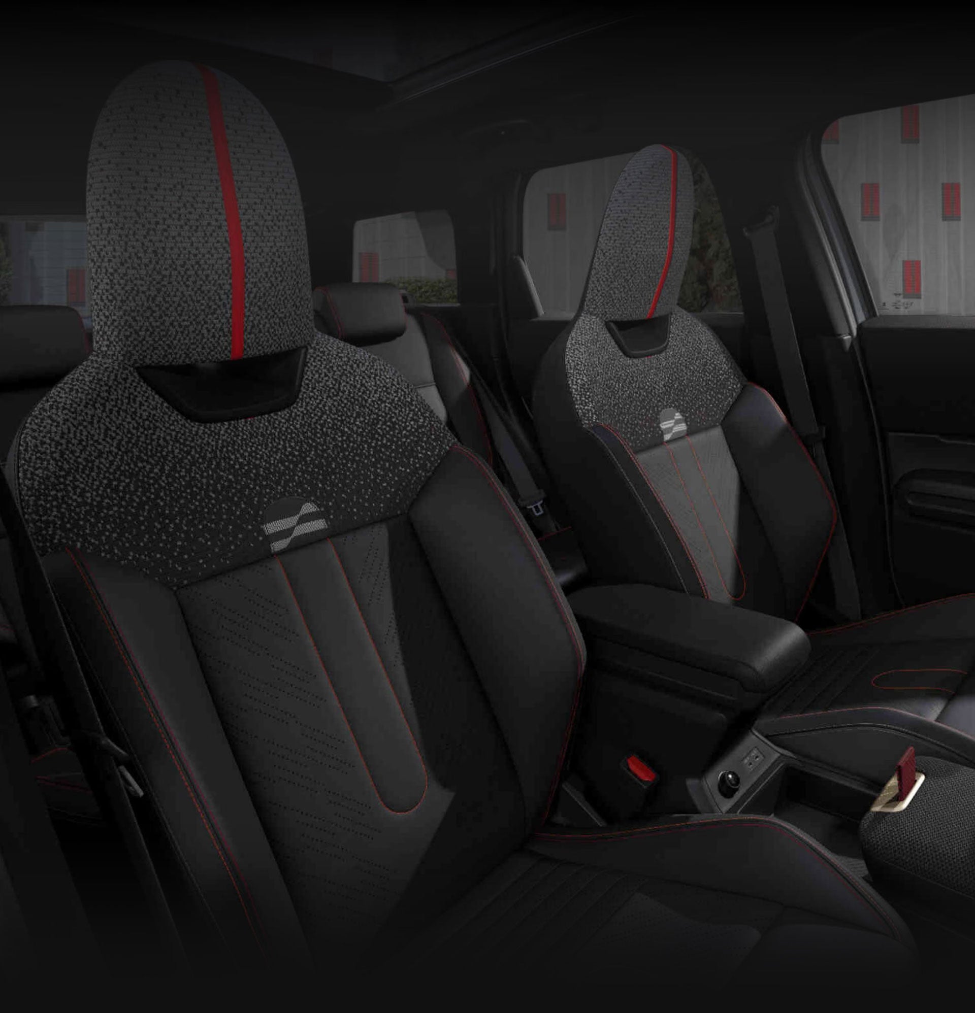 An angled-view of the inside of the MINI JCW Countryman ALL4 taken from the passenger's side showcasing the front JCW Sports Seats. 