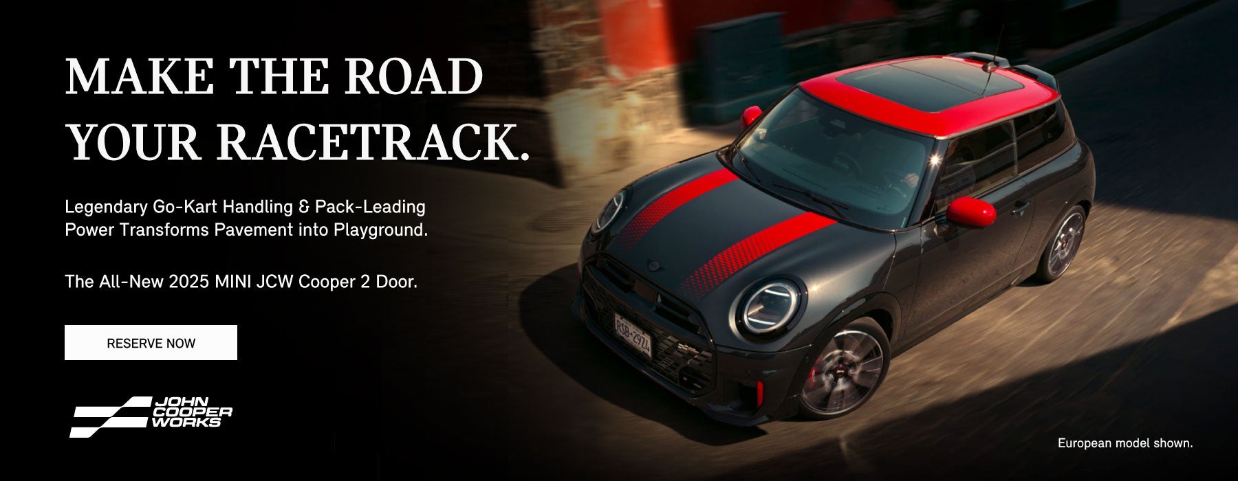¾ right view of a black MINI JCW convertible.