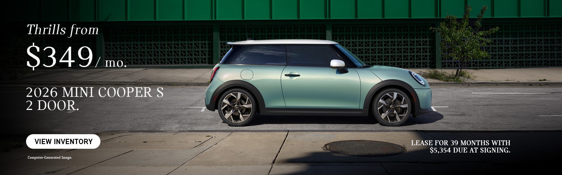 Side view of a green MINI 2 door parked on the road. 